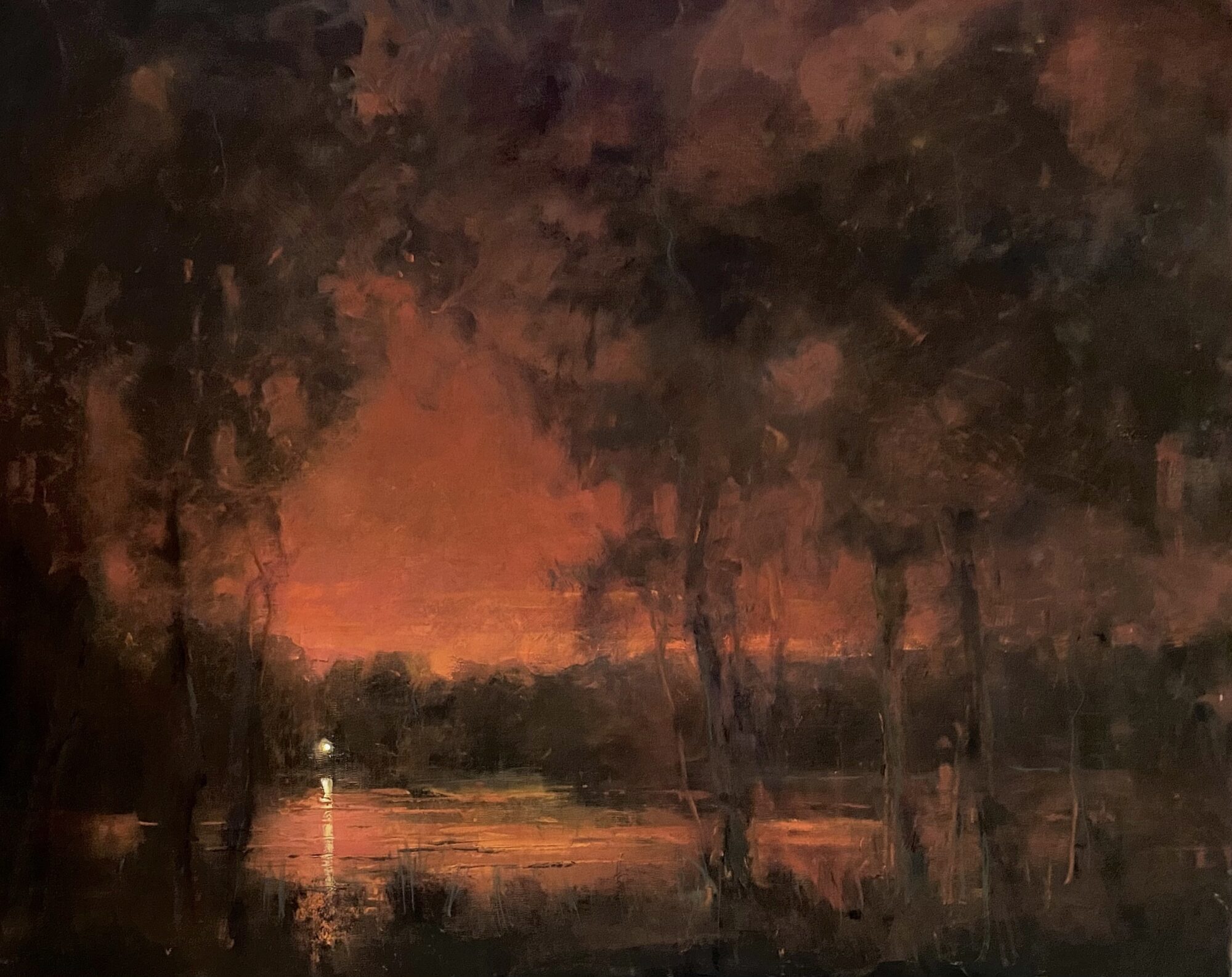 A dark, moody landscape with trees and a glowing red sky.