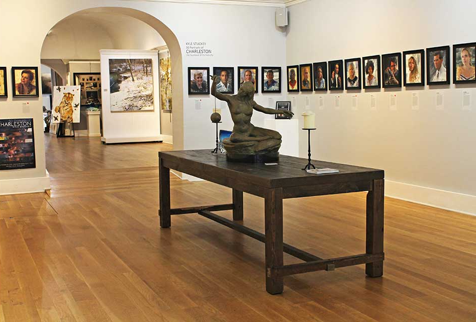 Wooden table in a gallery setting