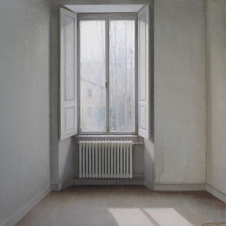 Empty room with a tall window letting in soft light.