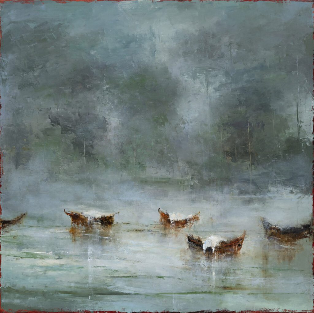 A misty landscape with deer standing in shallow water.