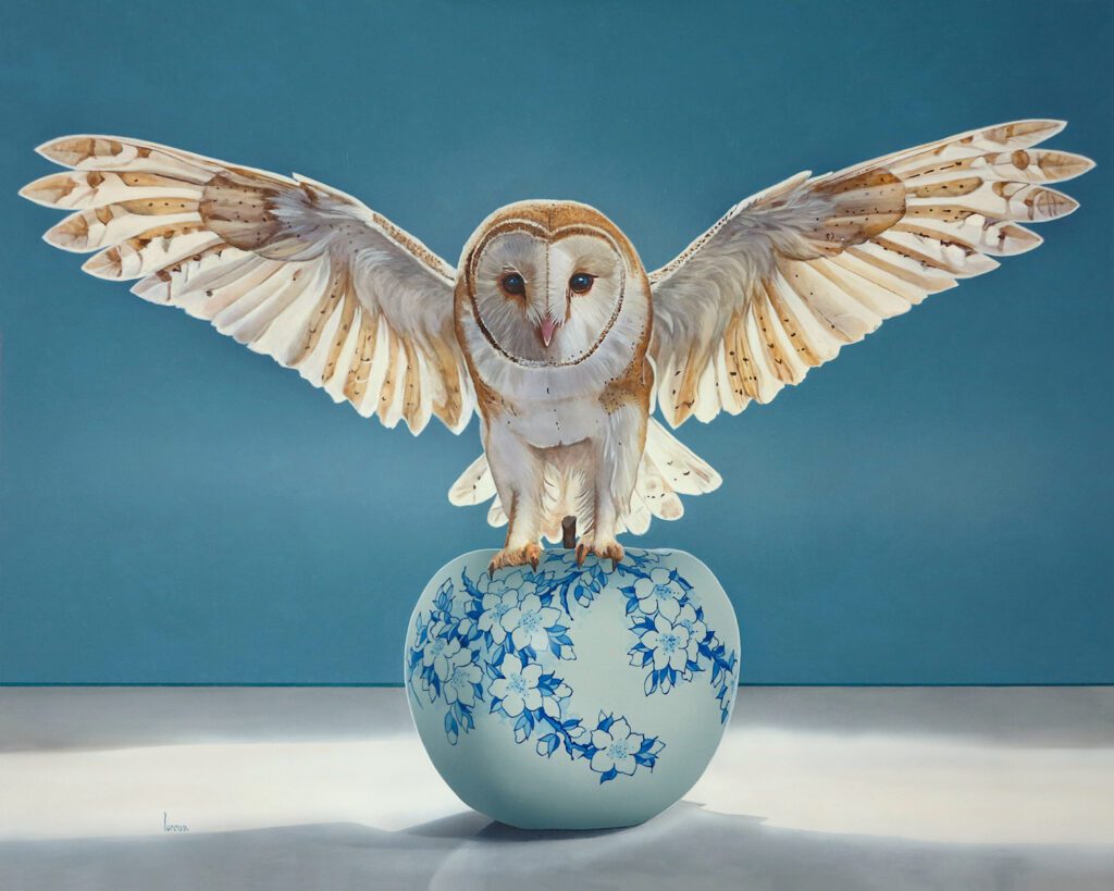 Owl perched on floral sphere