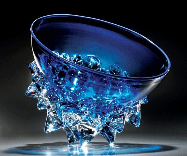 Elegant blue glass bowl with intricate crystal-like base design.