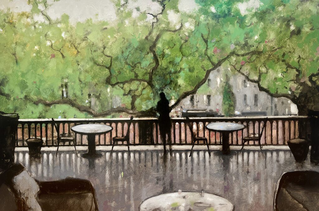 Silhouette on terrace with trees in background