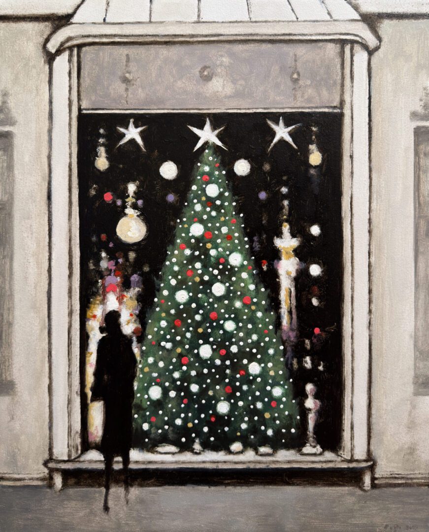 Person standing near a large decorated Christmas tree mural.