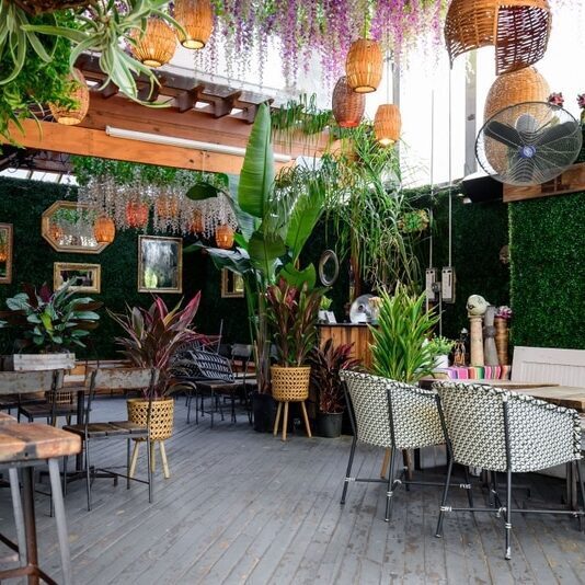 Cozy cafe with hanging wicker lamps