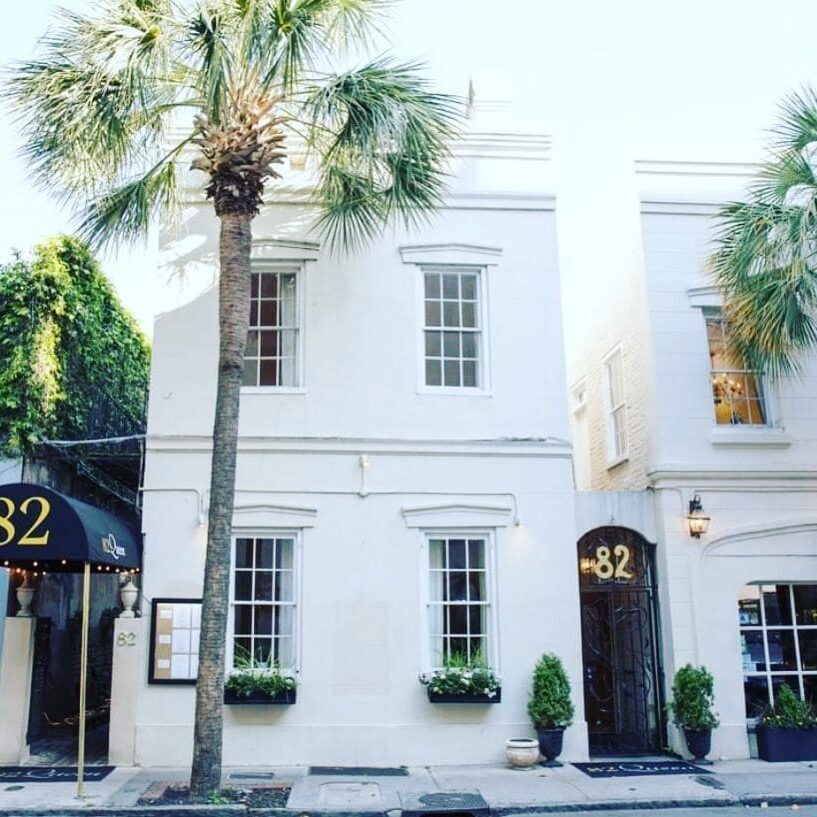 White building with palm trees