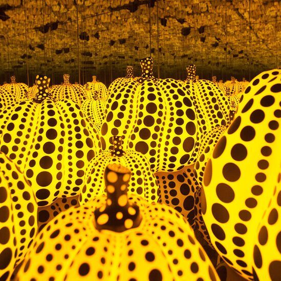 Infinity room filled with spotted pumpkins