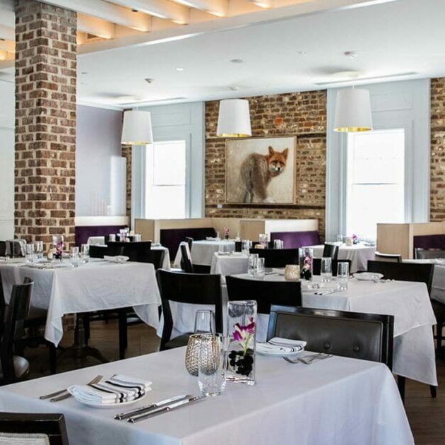 Elegant restaurant interior with brick accents