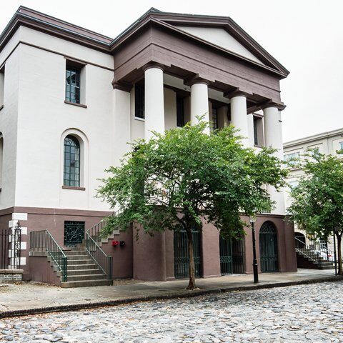 Elegant structure with arched windows and stairs