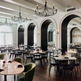 Modern dining room with arched windows