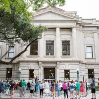 Historic building with crowd outside